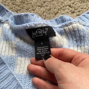 Lightly worn checkered blue sweater
